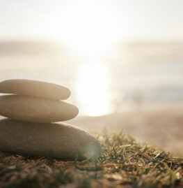 Closeup shot of a stack of stones on the beach